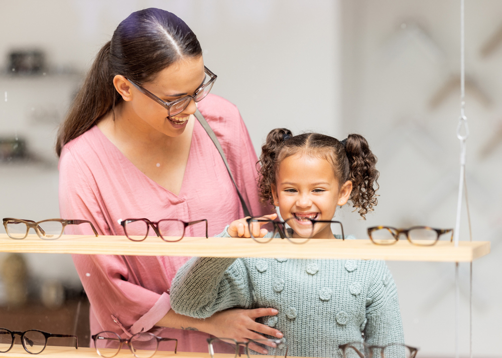 Mother and daughter glasses shopping