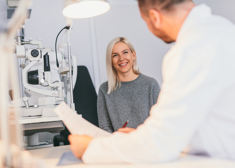 Female patient talking with her optometrist