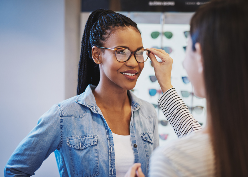 Young woman getting fitted for eyeglasses